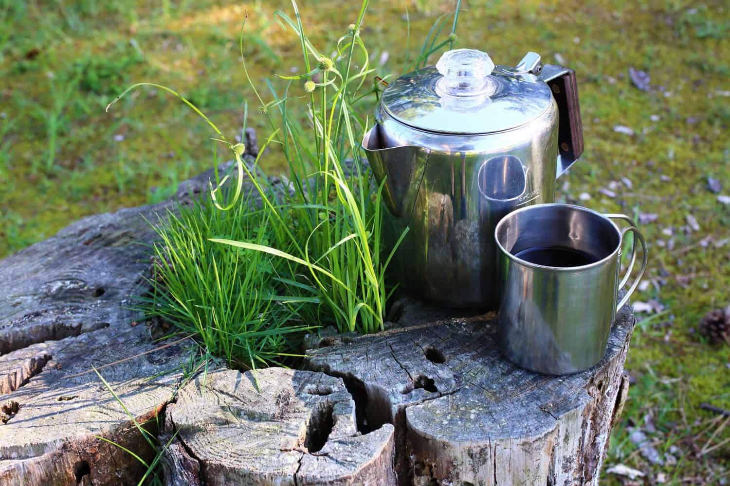 Best Stovetop Percolator and cup on wood stump